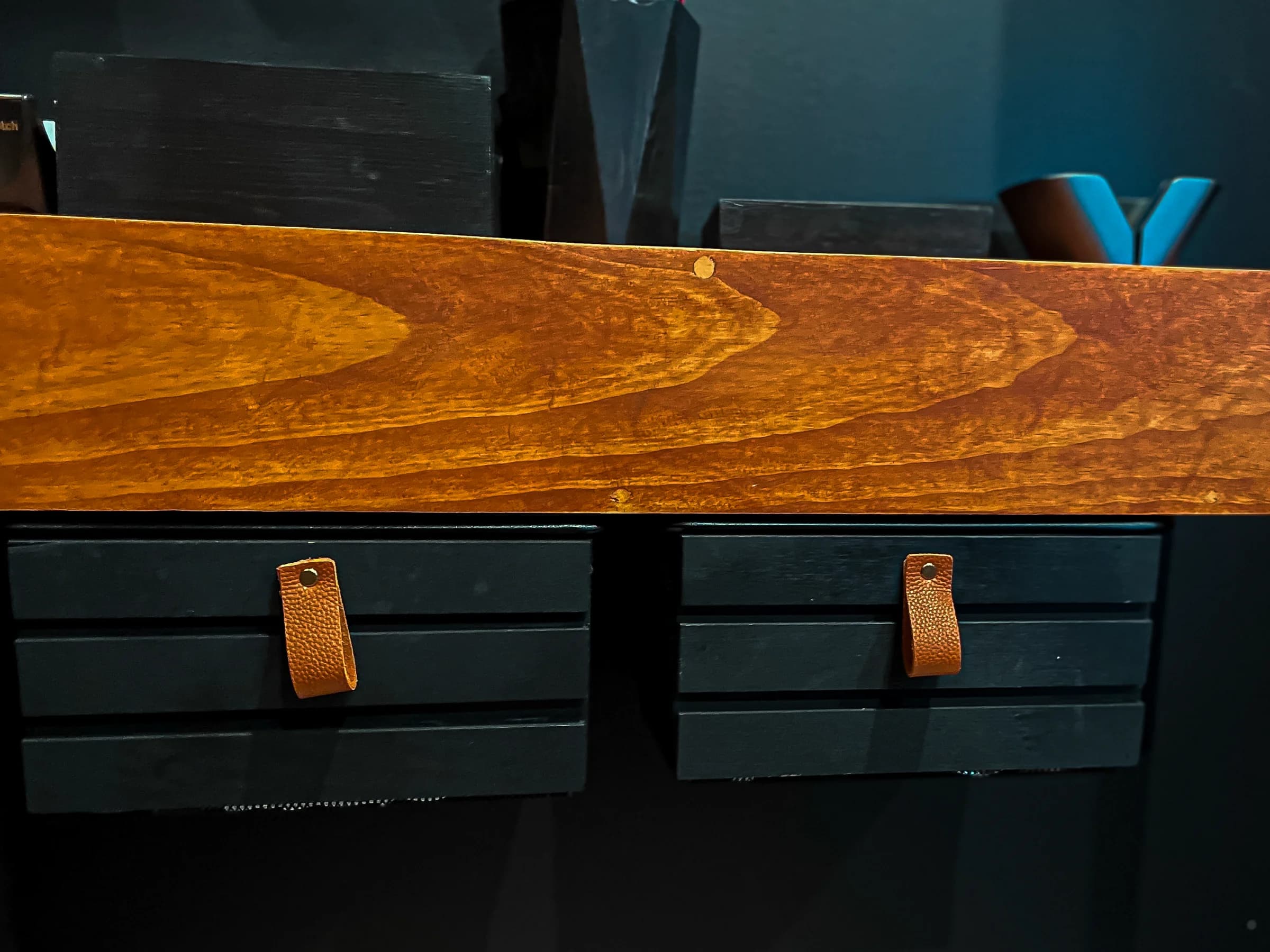 Dark home office cabinetry with a wood worktop and leather drawer pulls
