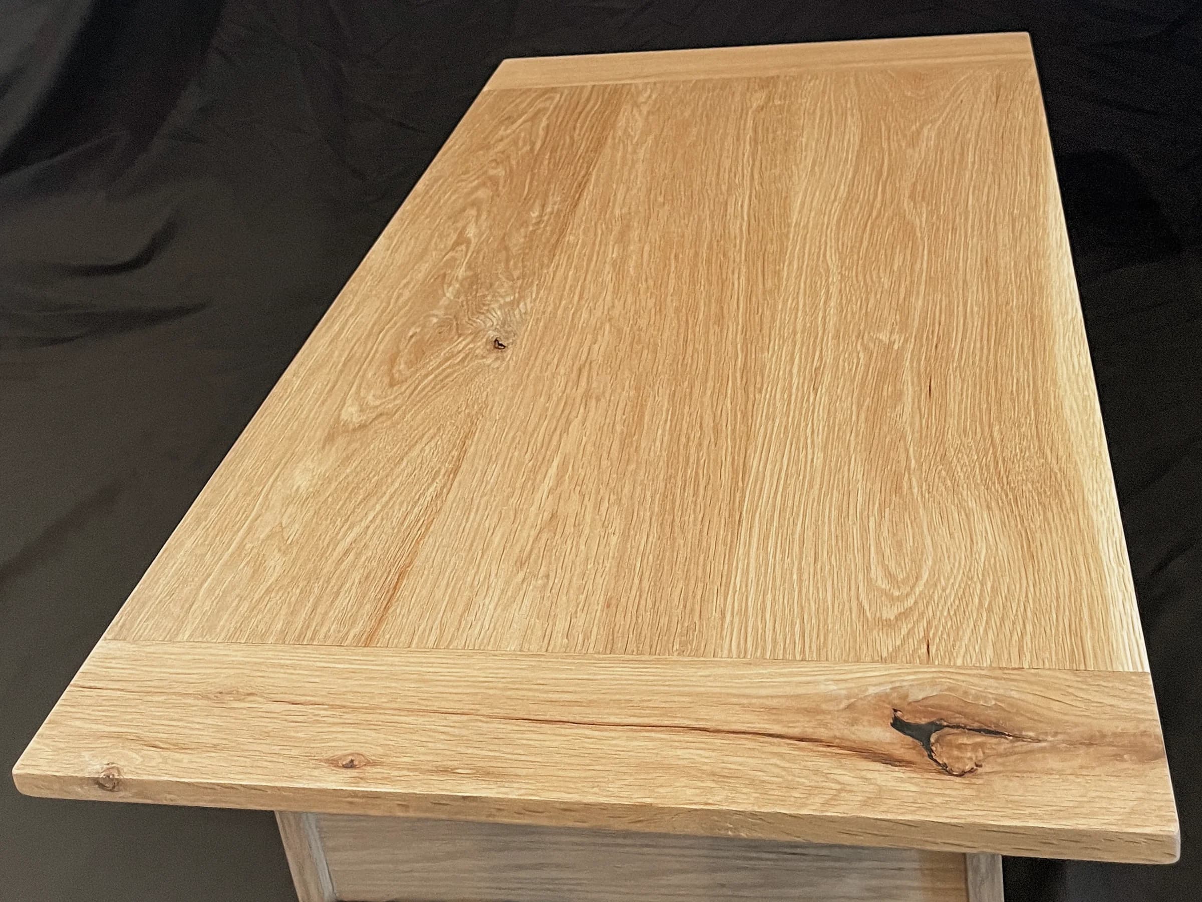 Handcrafted wood table with visible grain and contrasting end boards