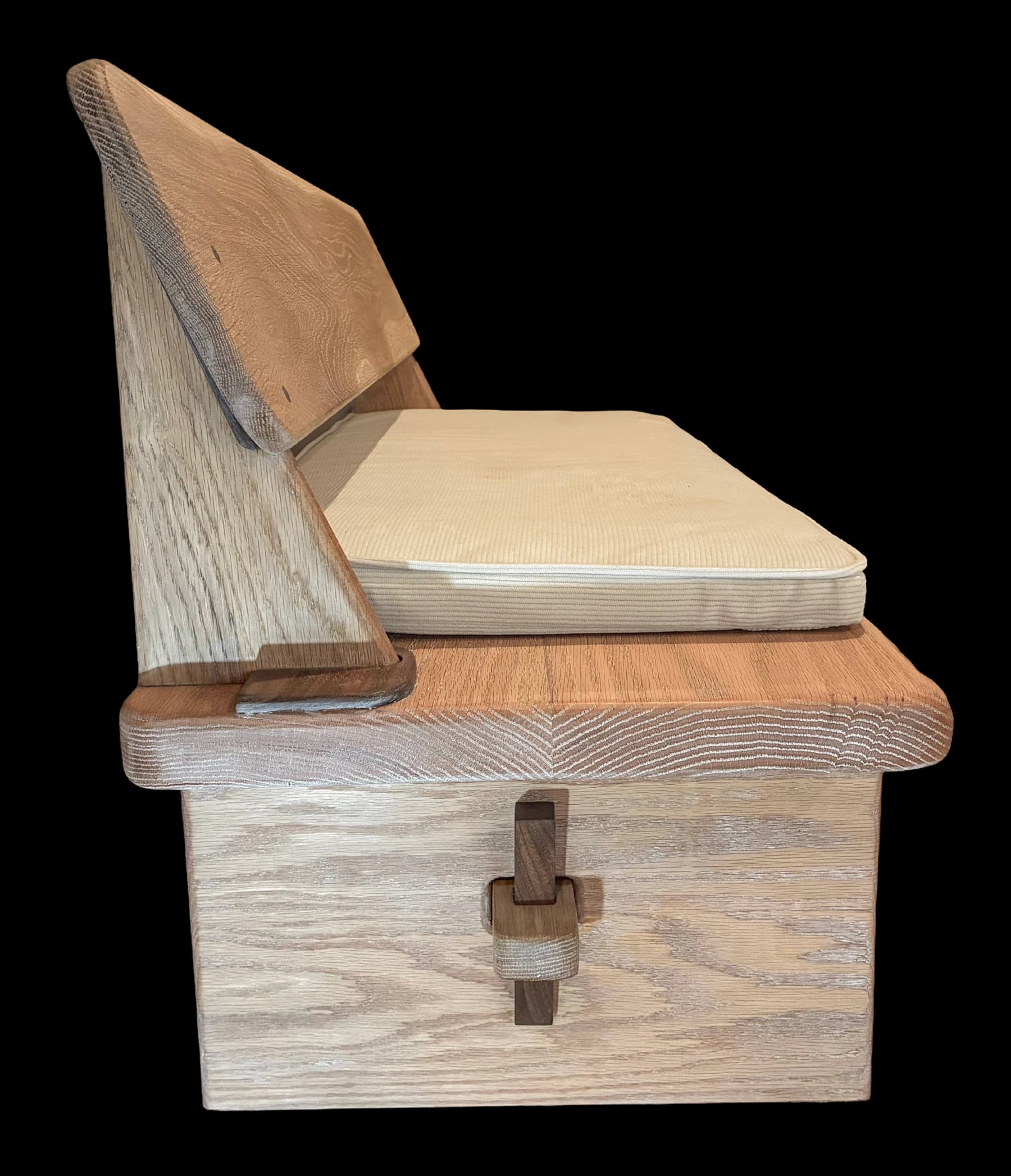 Hand-cut joinery in a solid oak seat with a fitted cushion