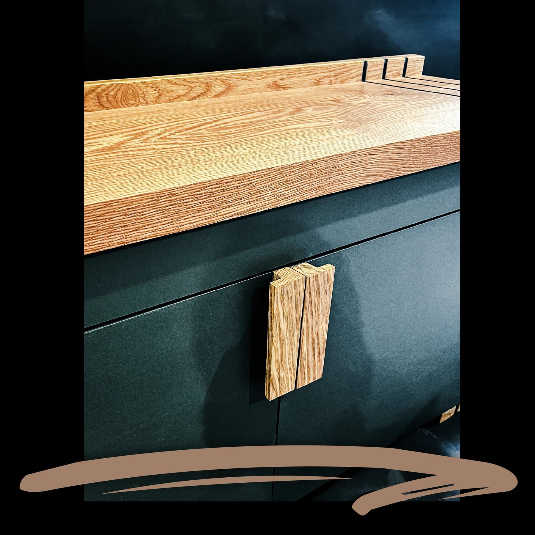 Dark cabinetry with a solid wood top and handcrafted wooden pulls