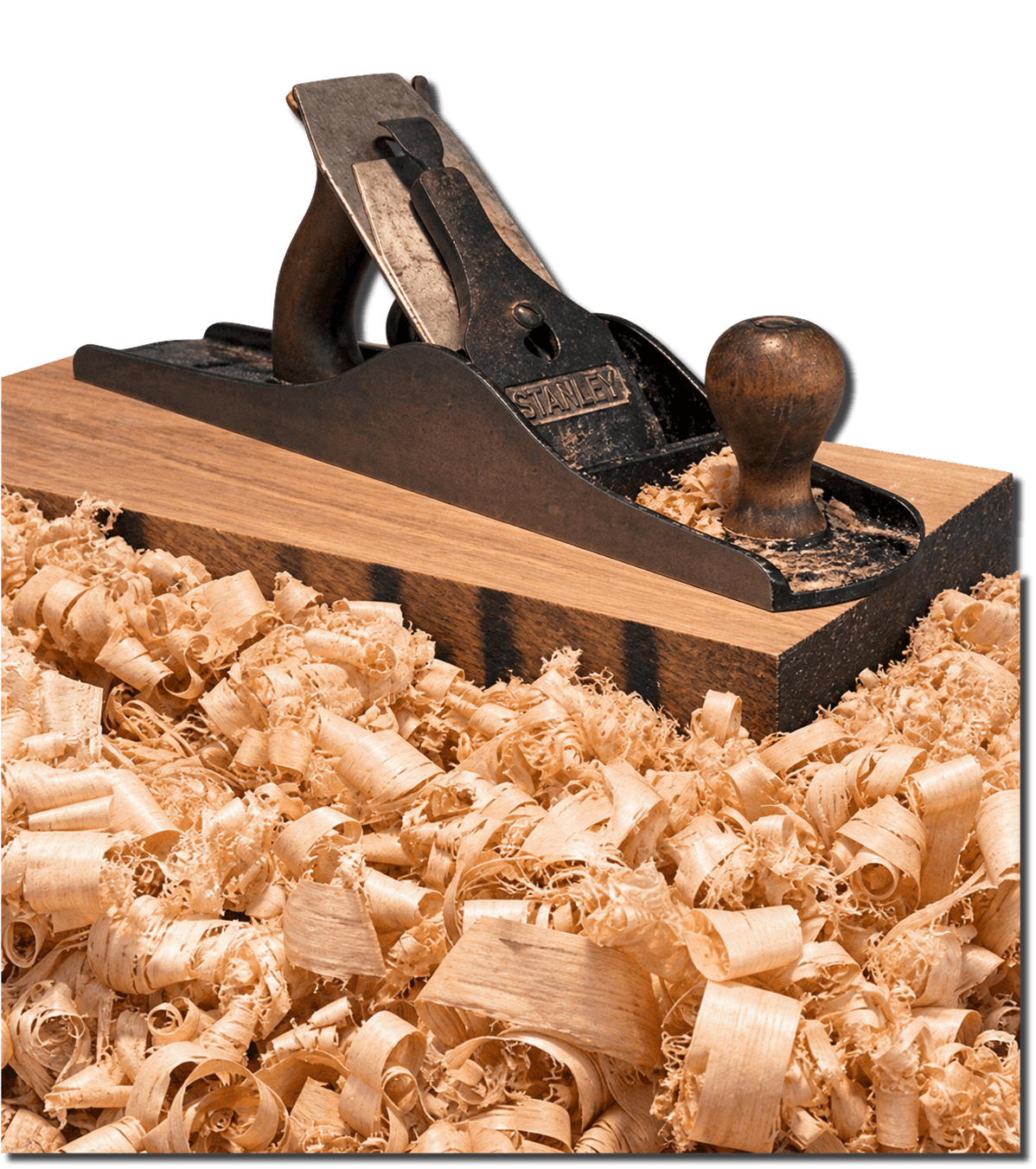 A hand plane resting on a board surrounded by wood shavings