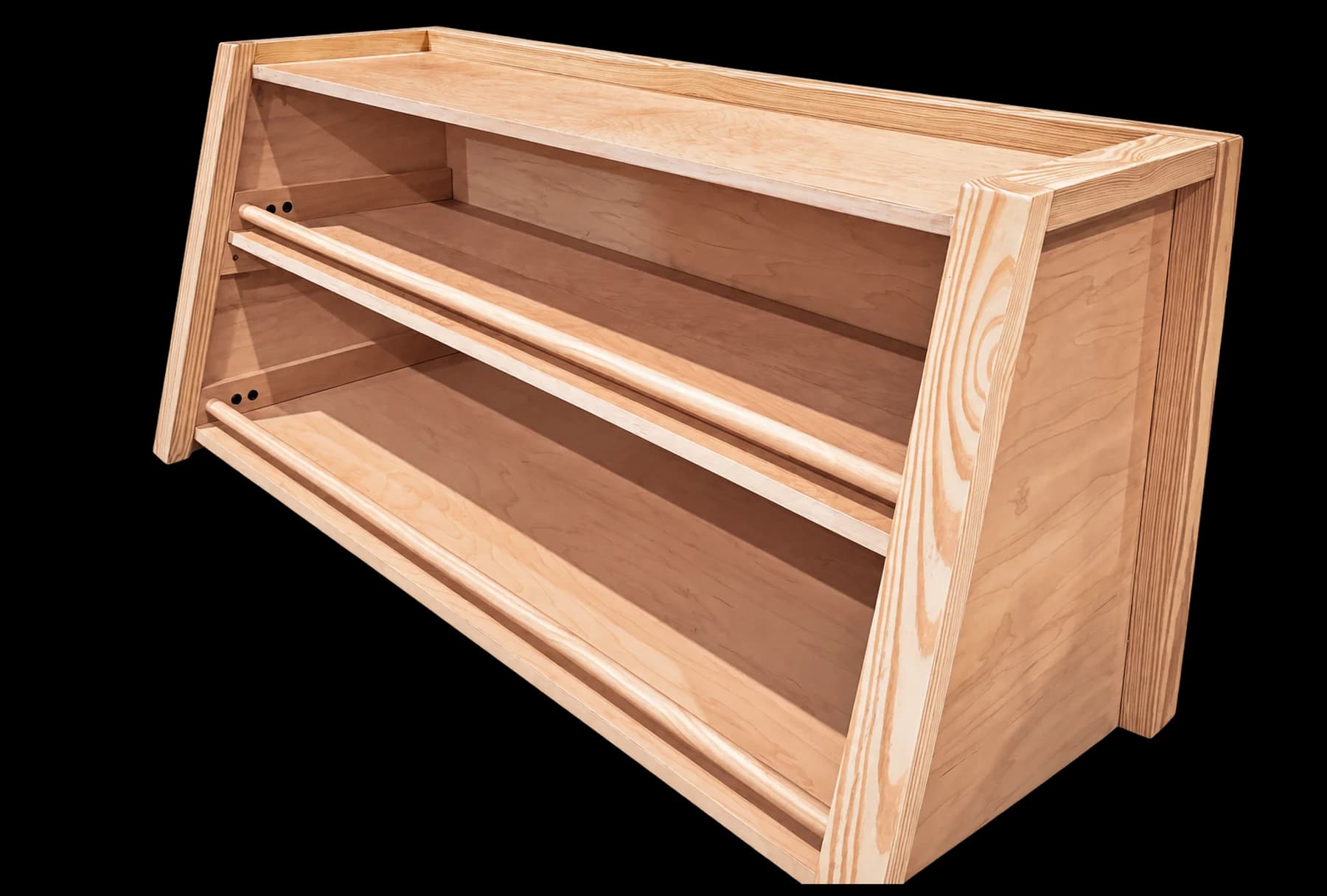 A handcrafted wooden display shelf with angled sides and rounded shelf rails