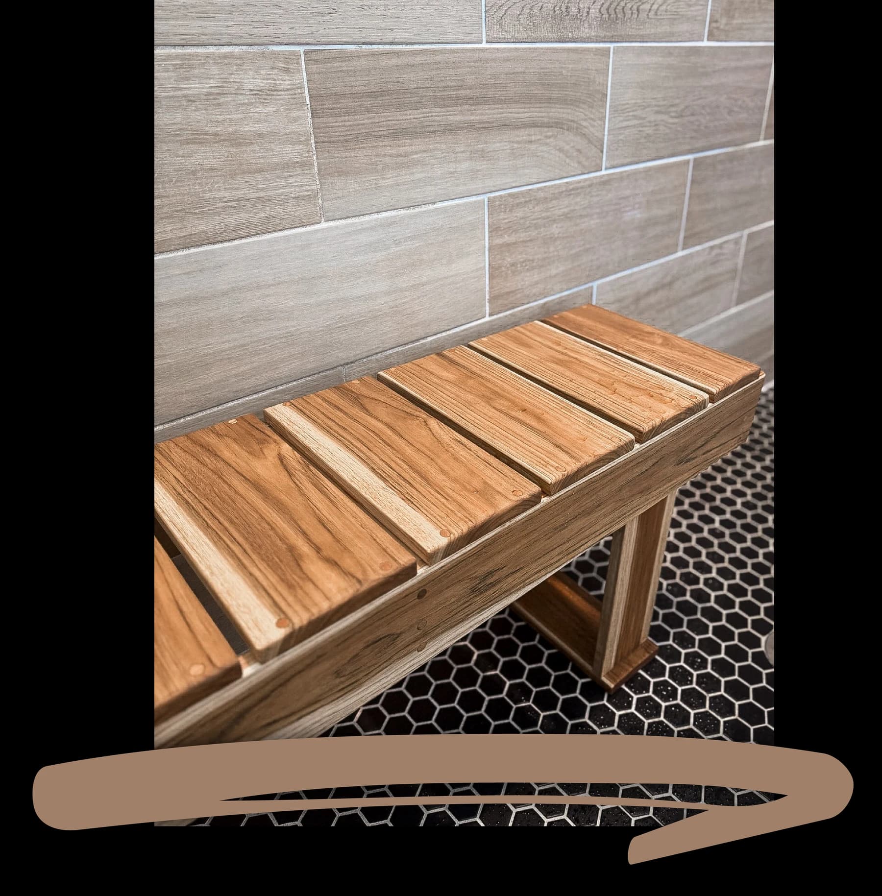 A handmade wooden shower bench against tile walls