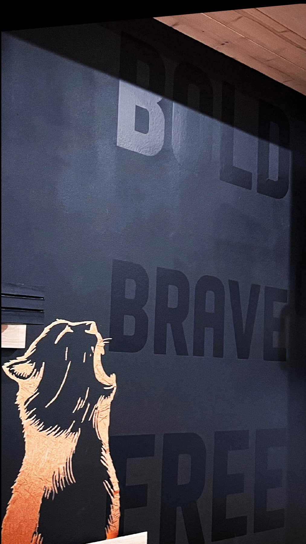 Bold brand lettering and artwork in a commercial space