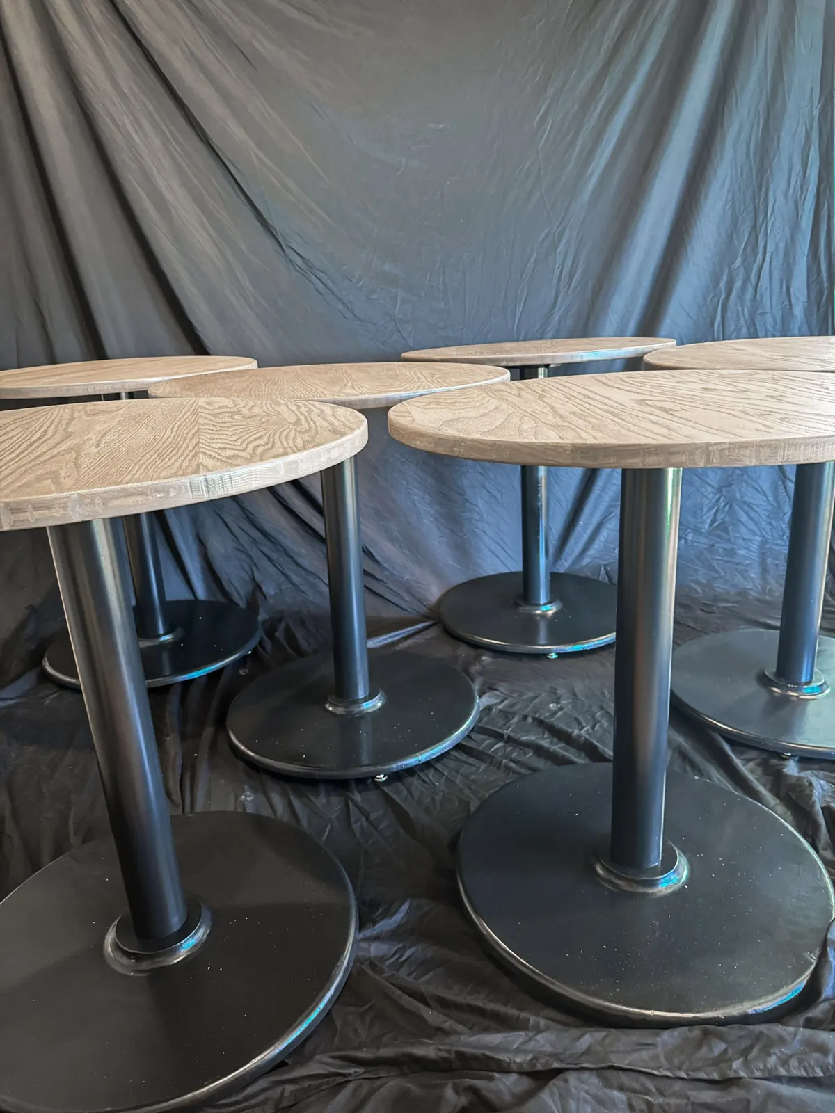 Custom round cafe tables prepared for a commercial space