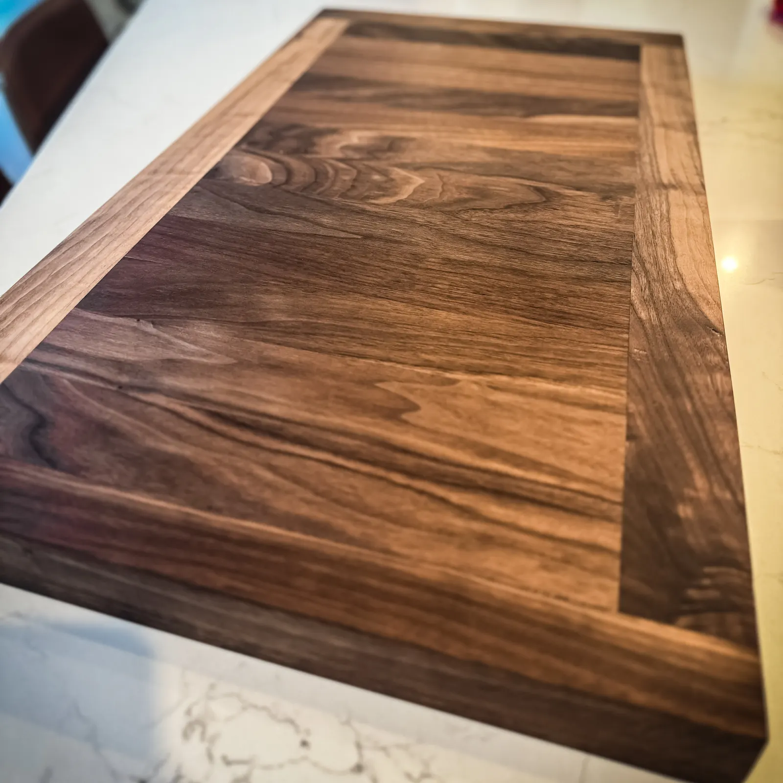 Close view of a richly figured custom solid wood tabletop