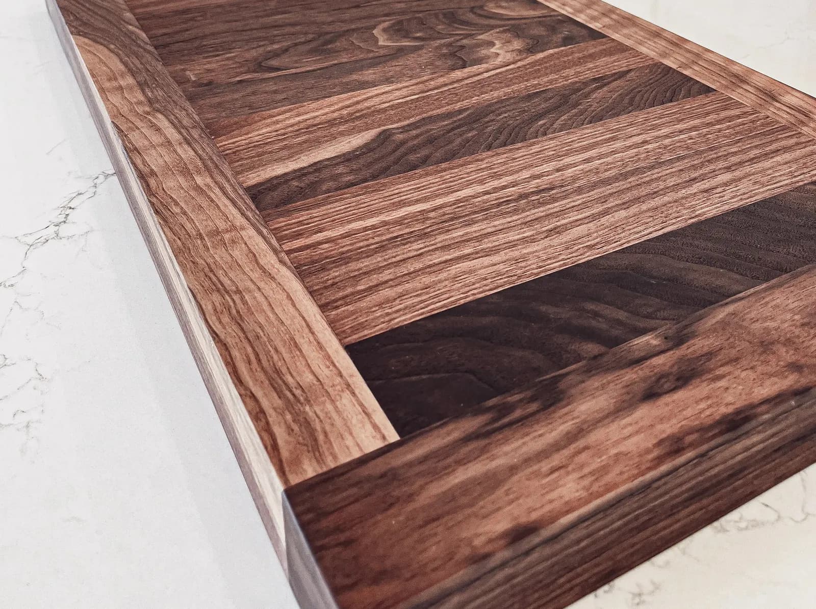 Detailed custom tabletop with framed grain and contrasting inlay