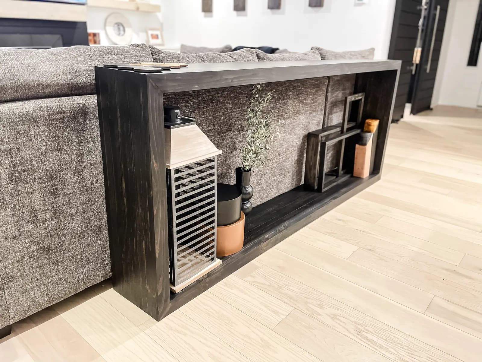 Custom wood console with an open shelf and lower storage